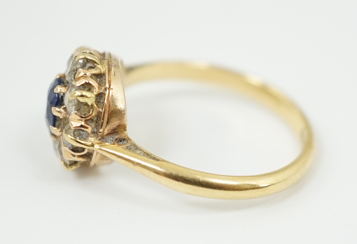 An 18ct gold, sapphire and diamond cluster ring